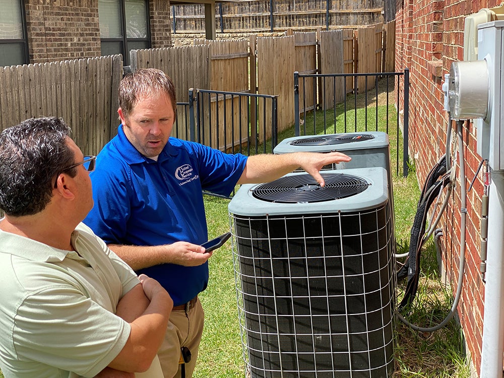 Seth Rosser doing an energy audit at member's home.